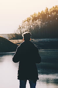 man standing in front of lake thumbnail