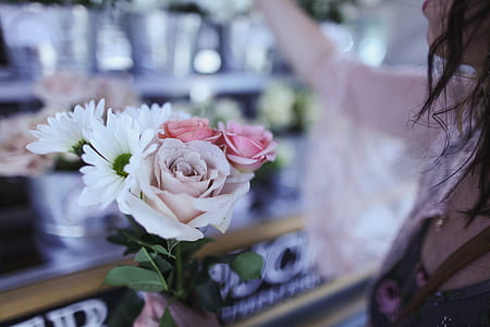 person holding flower bouquet thumbnail