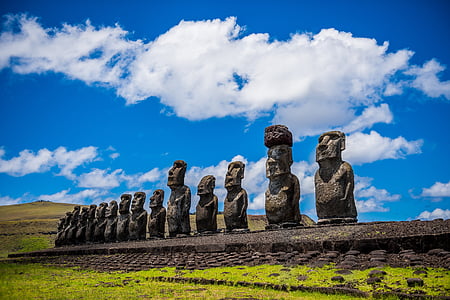 Moai statues under blue and white cloudy skies at daytime thumbnail