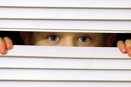 boy peeking from white window blinds thumbnail