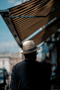 person wearing gray hat during daytime thumbnail