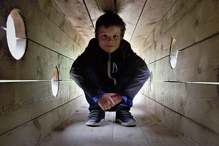 boy inside wooden box thumbnail