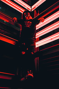 person hanging on the corner of a building thumbnail