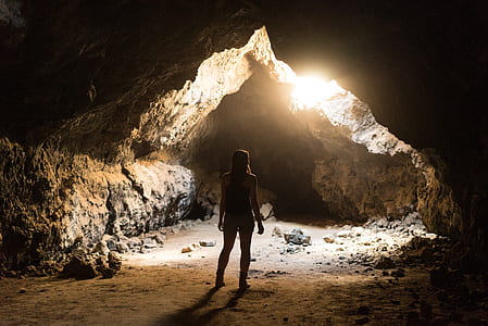 woman standing inside the cave thumbnail