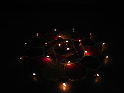 lighted candles on black floor surface thumbnail