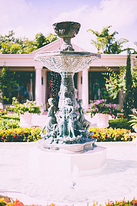 brown outdoor fountain near garden thumbnail