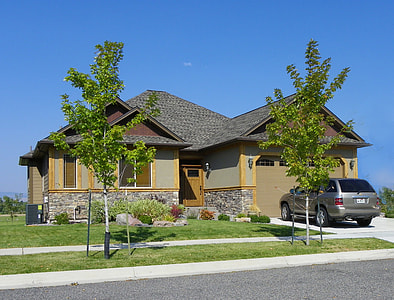 yellow and gray bungalow house with gray SUV on driveway thumbnail
