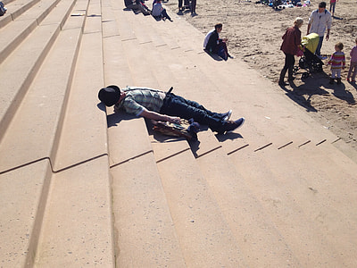 man lying on stairway thumbnail