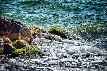 water flowing on rocks with moss thumbnail