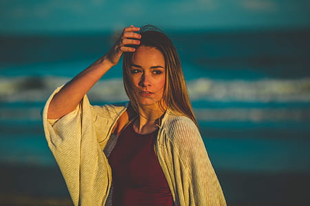 woman taking photo in front of seashore thumbnail