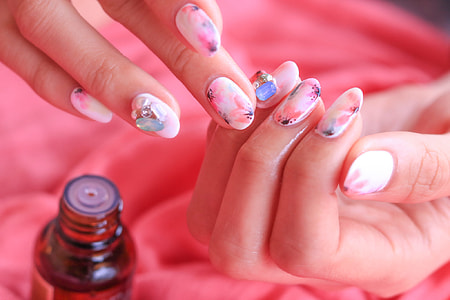 closeup photography of human nail with nail arts thumbnail