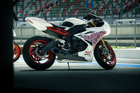 sports bike parked near motorcycle thumbnail