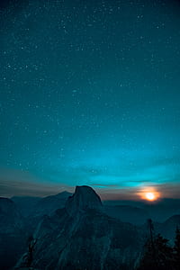 aerial view of mountain under starry sky thumbnail