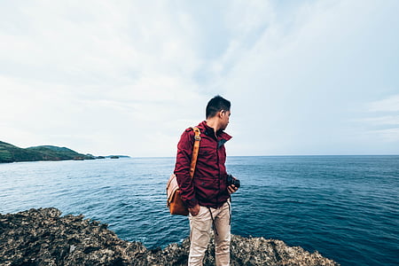 man looking at blue seawater thumbnail