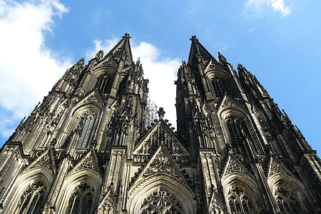 low angle photography of gray cathedral at daytime thumbnail