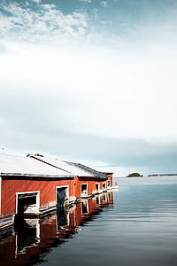 red houses on body of water thumbnail