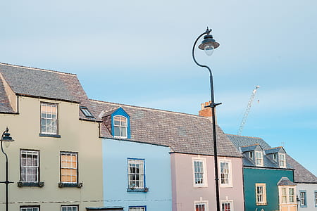 closeup photo of assorted-color houses near outdoor post lamp thumbnail