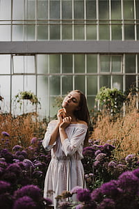 woman in the center of flower field thumbnail