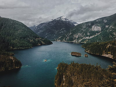 body of water near mountains thumbnail