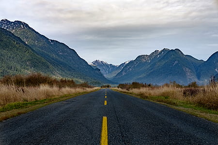 pavement road leading to mountain thumbnail
