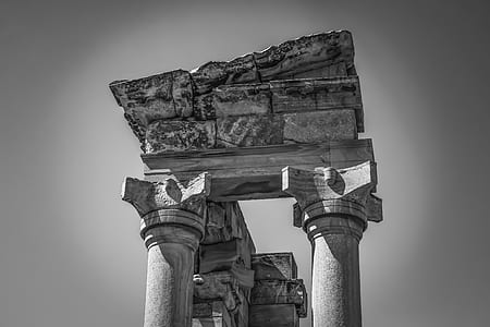 concrete pedestals in grayscale photography thumbnail