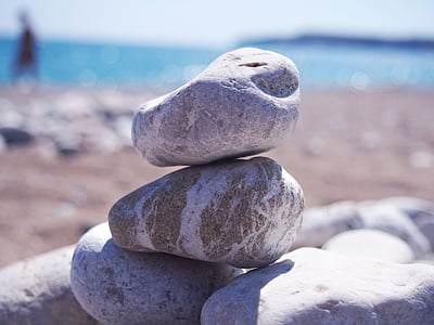 selective focus photography of balance stone at the beach thumbnail