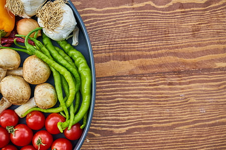 green chili, mushrooms, and red cherry tomatoes in gray plate thumbnail