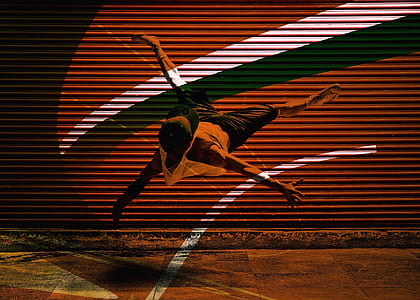 man dancing near door shutter thumbnail