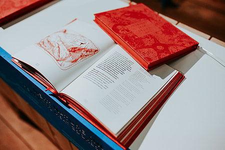 Red book on a white table thumbnail
