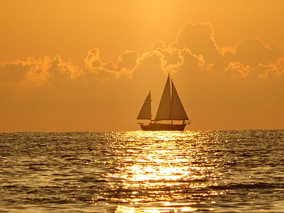 black sailboat on body of water thumbnail