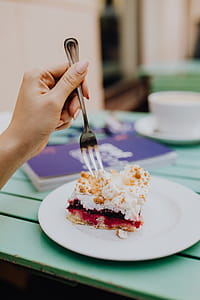 Drinking coffee and eating cake in a cafeteria thumbnail