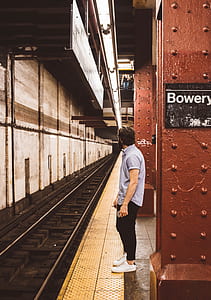 man in teal polo shirt with black pants and white sneakers thumbnail