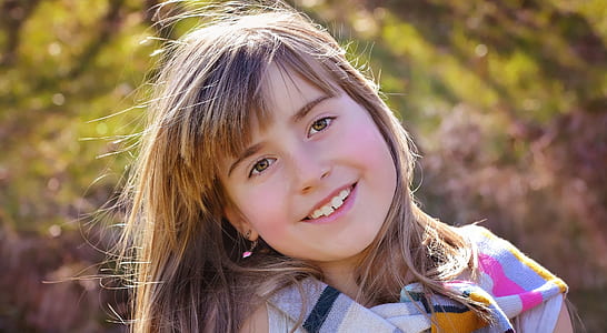 girl smiling while her head tilting at right side thumbnail