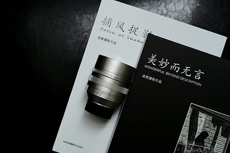cylindrical silver component on top of white printing paper thumbnail