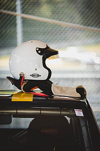 white open-face helmet on top vehicle roof thumbnail