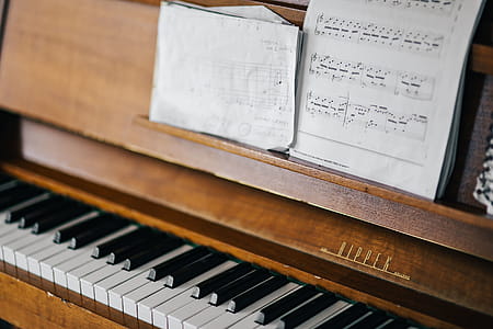 Old piano with sheet music thumbnail