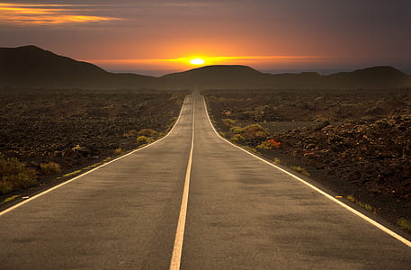 asphalt road during sunset thumbnail