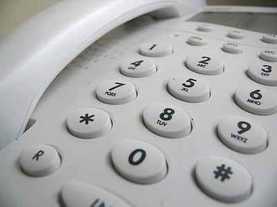 closeup photo of white telephone thumbnail