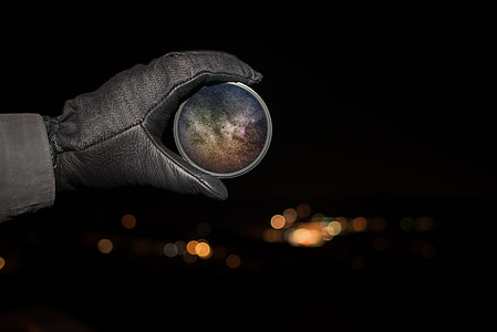 person holding round gray container thumbnail