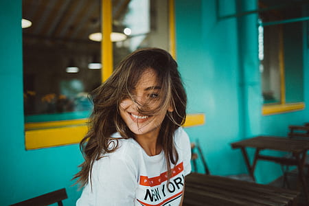 woman sitting on chair near table thumbnail
