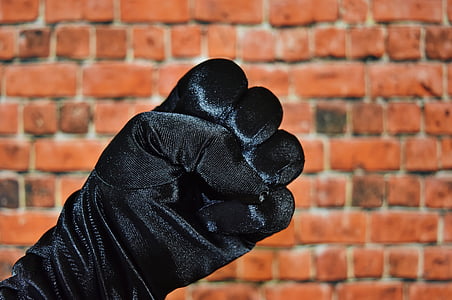 person wearing black hand gloves with letter s finger sign thumbnail