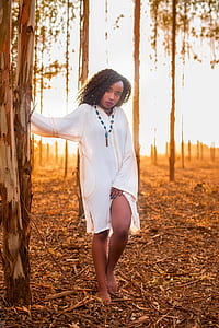 woman posing under tree thumbnail