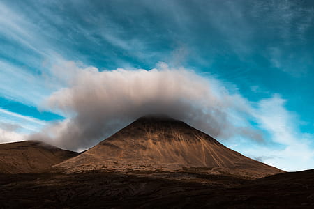 brown mountain under gray clouds thumbnail