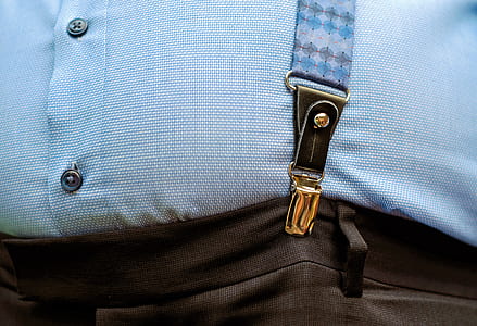 person wearing black pants and blue suspendeer thumbnail