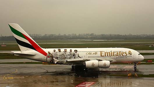 white United Arab Emirates airplane on airport thumbnail
