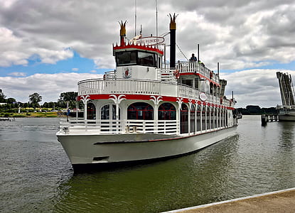 white steamship near wooden dock thumbnail
