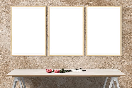 two red roses on rectangular brown wooden trestle table thumbnail