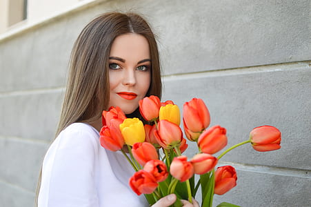 woman holding pink flowers thumbnail