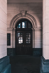 closed brown wooden door thumbnail