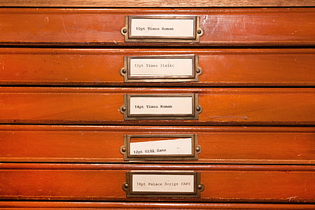 brown-and-white tags on red board thumbnail